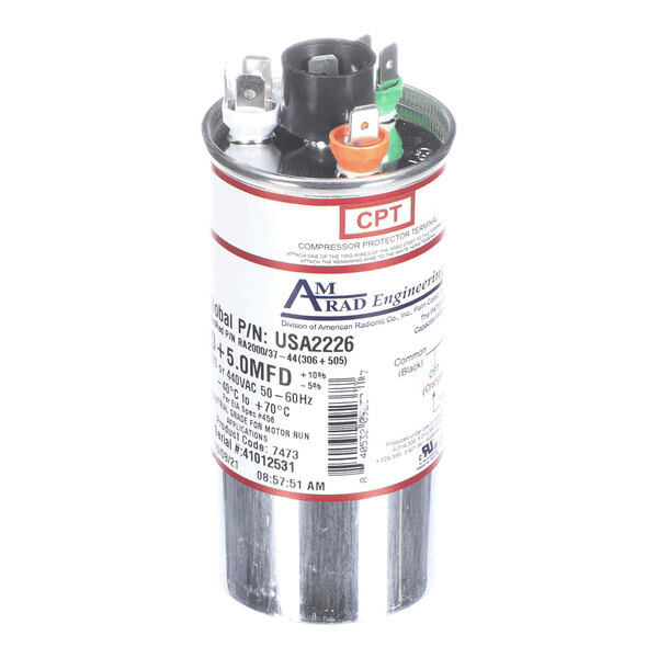 A cylindrical metallic capacitor with three color-coded terminals and a label displaying technical specifications.