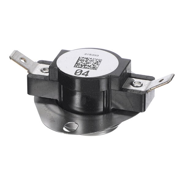 A small, round, black and silver electronic component with two metal terminals and a label on top.
