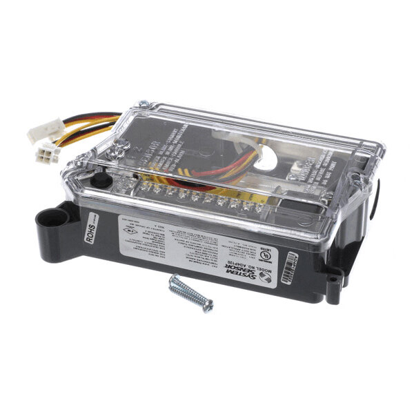 A rectangular electronic control board with a transparent cover, visible wiring, connectors, and a loose screw placed beside it.