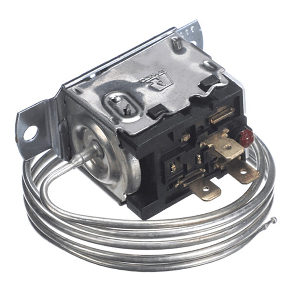 A metal and plastic electrical component with a coiled metal tube attached, featuring several terminals and mounting brackets.