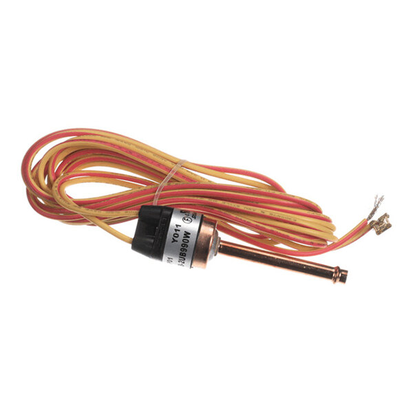 A cylindrical metal sensor or switch with attached yellow and red wires coiled beside it.