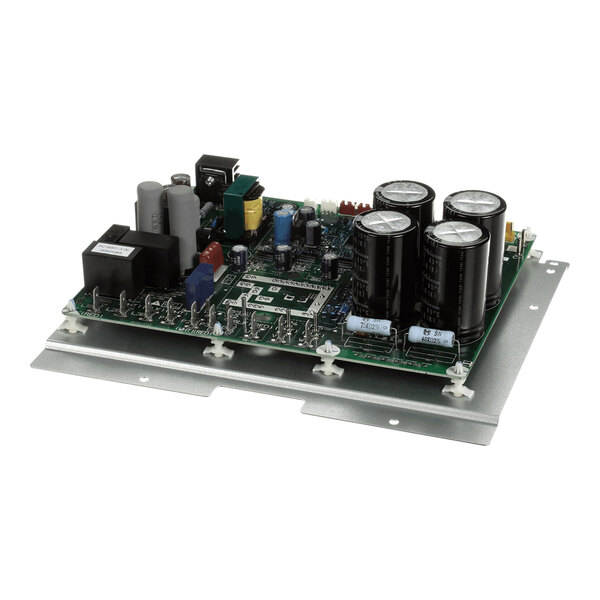 An electronic control board with various capacitors, resistors, and other components mounted on a metal base plate.