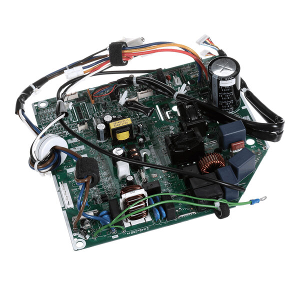 A green printed circuit board with various electronic components, wires, and connectors attached.