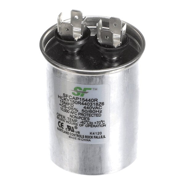 A cylindrical metal capacitor with two sets of electrical terminals on top and a label displaying technical specifications.