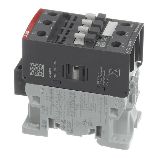 A three-pole electrical contactor with labeled terminals and a combination of black and gray housing.