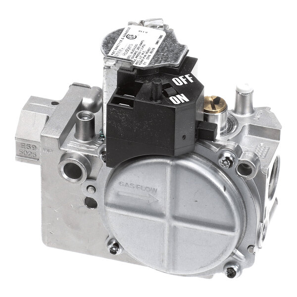 A metallic gas valve assembly with a black on/off switch and various ports and labels visible.