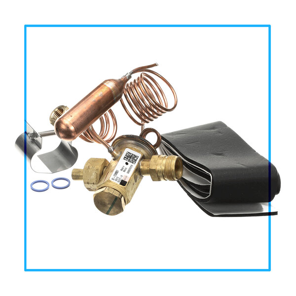 A brass and copper thermal expansion valve assembly with coiled tubing, rubber insulation, and additional small components.
