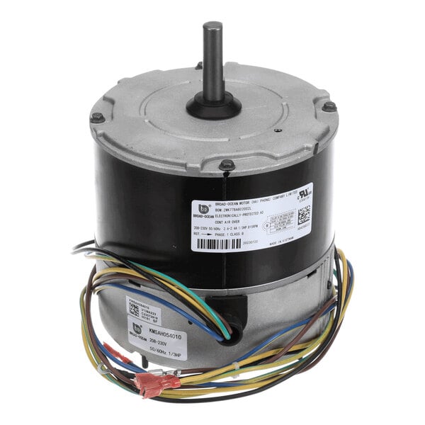 A cylindrical electric motor with a central shaft and multiple colored wires extending from the base.