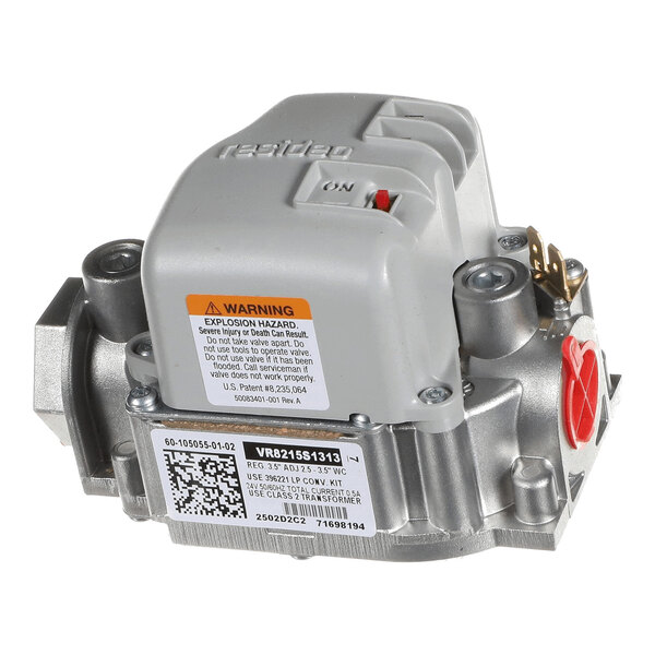 A metallic and gray gas valve with a warning label, QR code, and an ON/OFF switch visible on the top.