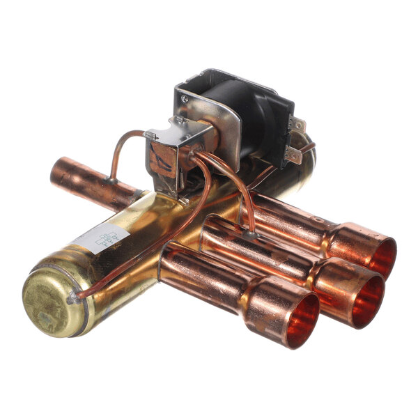 A metallic component with copper tubing and an attached electrical solenoid, likely used in HVAC or refrigeration systems.