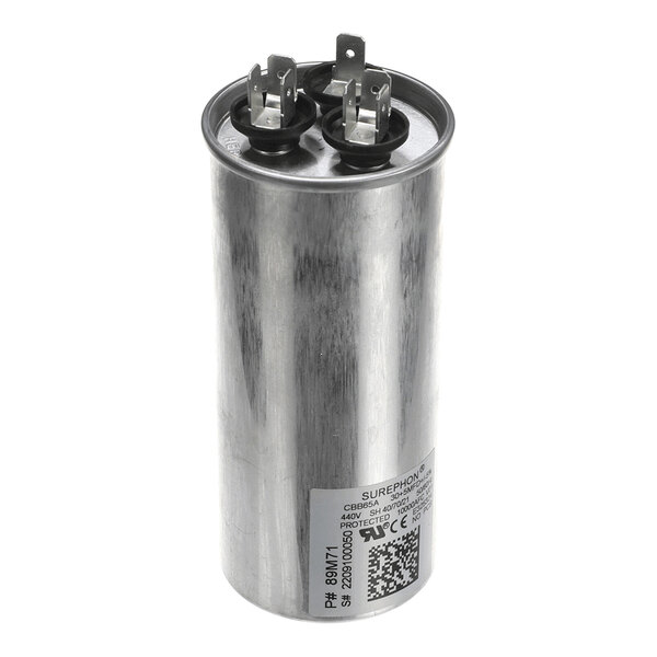 A cylindrical metallic component with two sets of electrical terminals on top and a label with text and a QR code on the side.