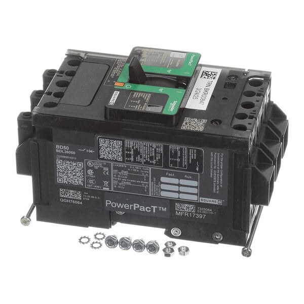 A black electrical circuit breaker with green labels, multiple connection ports, and several nuts and washers placed in front of it.