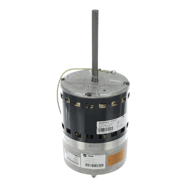 A cylindrical electric motor with a central shaft extending vertically, featuring ventilation slots and several labels attached to its body.