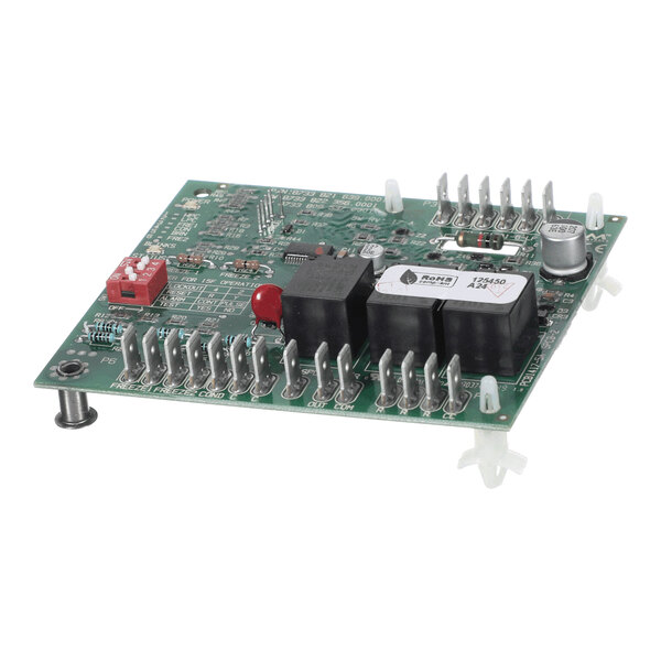 A green electronic circuit board with various components, connectors, and relays mounted on it.