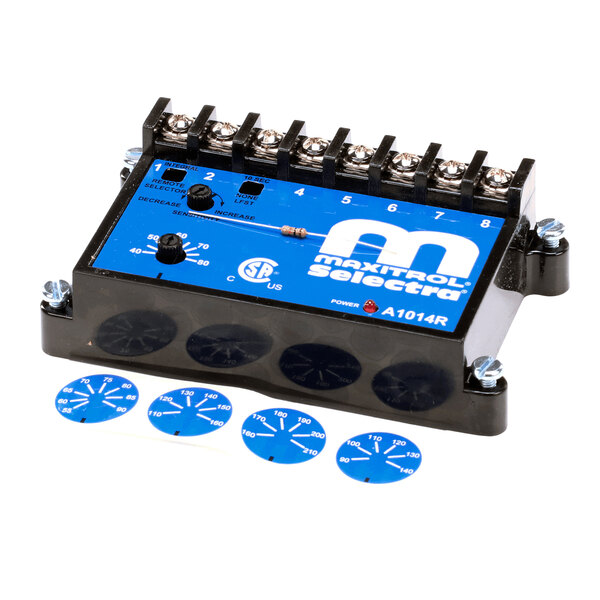 A black and blue electronic control module with multiple screw terminals on top and several blue dial stickers placed in front of it.