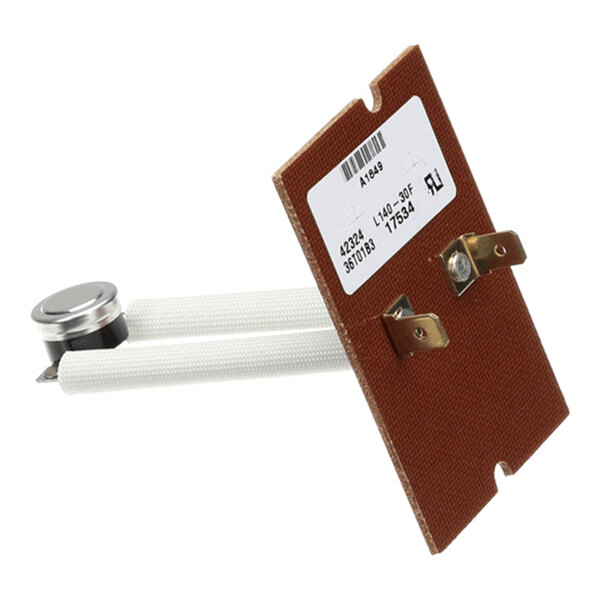A rectangular brown component with two white cylindrical rods, a metallic circular part, and two metal terminals, featuring a white label with printed information.