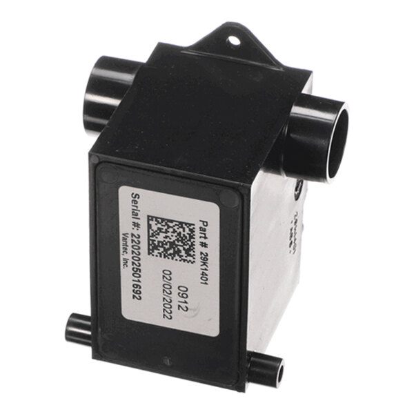 A black rectangular device with four cylindrical ports and a label displaying a serial number, part number, and QR code.