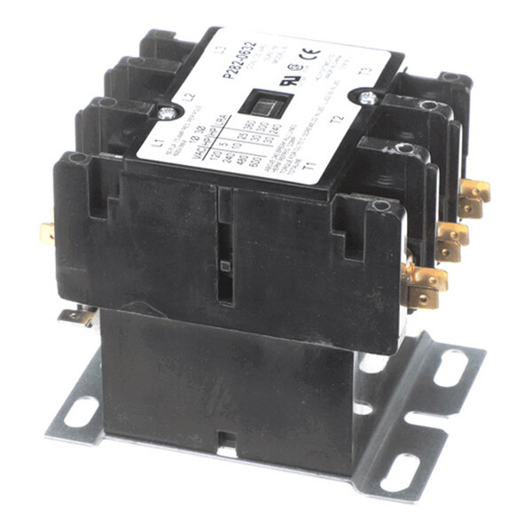 A black electrical contactor with multiple terminals and a white label on top, mounted on a metal base.