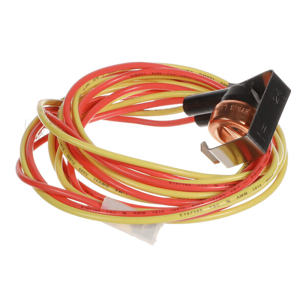 A coiled set of red and yellow electrical wires attached to a small black and copper component with a metal clip.