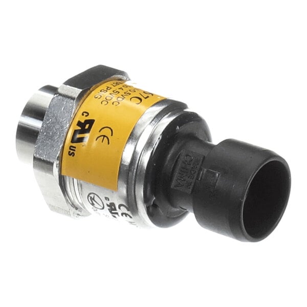 A small cylindrical electronic component with a yellow label, metal hex nut, and black plastic connector.