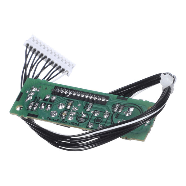 A green circuit board with multiple soldered components and black wires connected to a white connector.