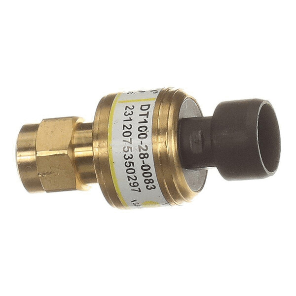 A small cylindrical brass and black component with a label displaying numbers and text, likely an industrial sensor or transducer.