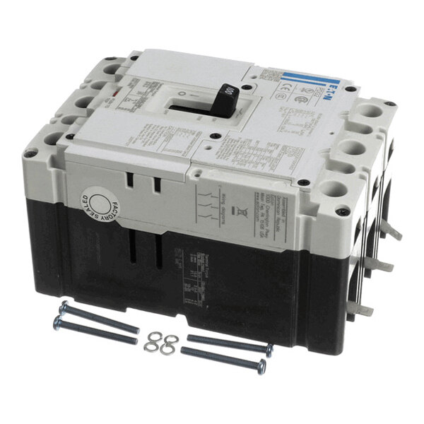 A large rectangular electrical circuit breaker with a black switch on top, accompanied by four screws and washers.