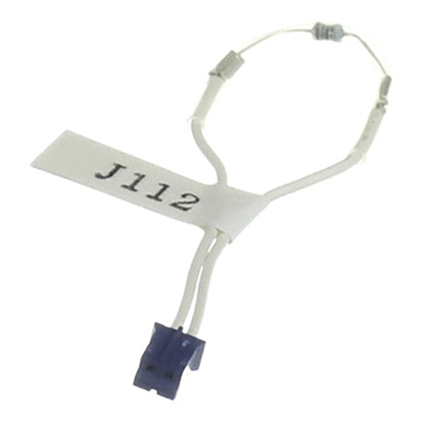 A small electronic component with white wires, a blue connector, and a label marked 'J112' attached to it.