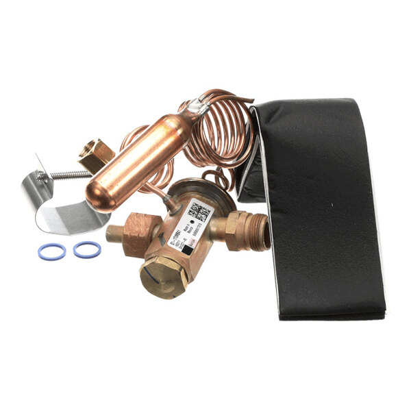 A collection of metal components including a copper coil, brass fittings, a black insulated wrap, and two blue O-rings, likely part of a mechanical or HVAC assembly.