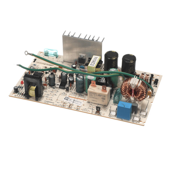 A rectangular electronic circuit board with various components including capacitors, coils, relays, a heat sink, and a green wire, all mounted on a light-colored board.