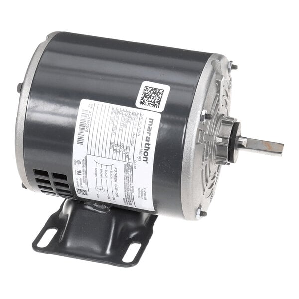 A cylindrical electric motor with a metal mounting base, visible shaft, and a label with technical specifications attached to the side.