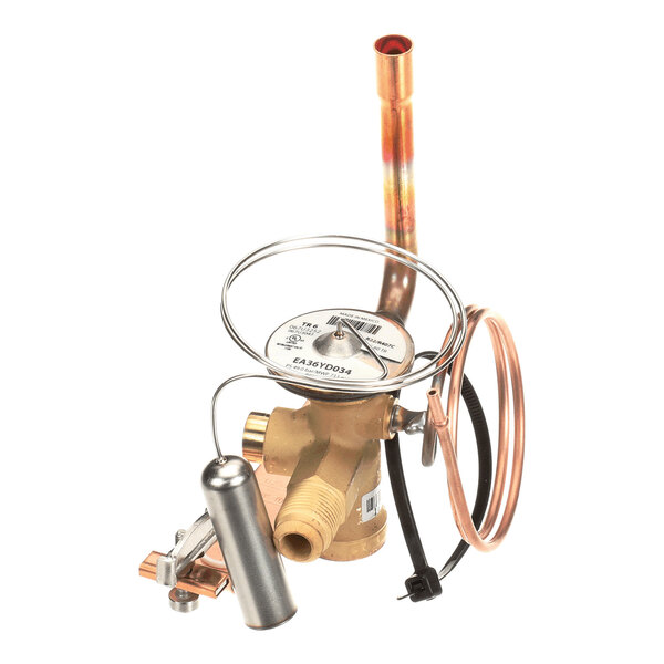 A brass and copper mechanical valve assembly with coiled tubing and a cylindrical component attached, likely part of a refrigeration or HVAC system.