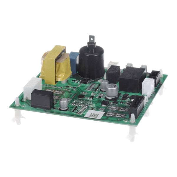 A green electronic circuit board with various components including capacitors, relays, connectors, and a transformer, mounted on white standoffs.