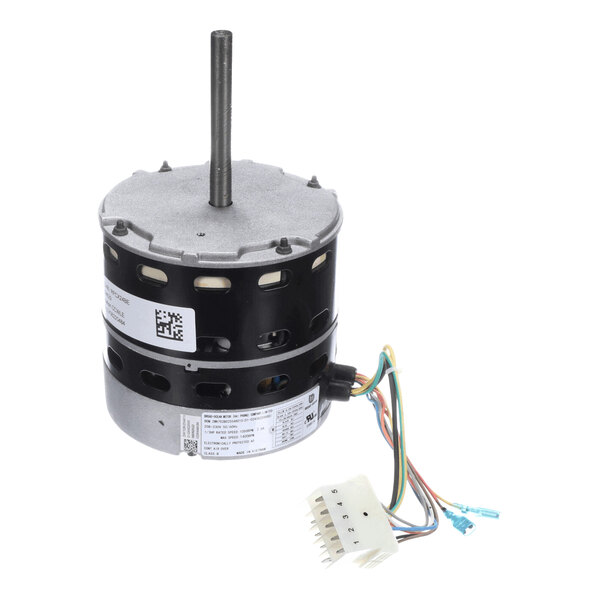 A cylindrical electric motor with a central shaft, multiple colored wires, and a white connector attached.