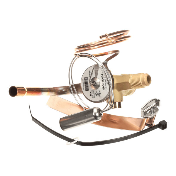 A metallic valve assembly with attached copper tubing, a coiled wire, and various metal and plastic components.