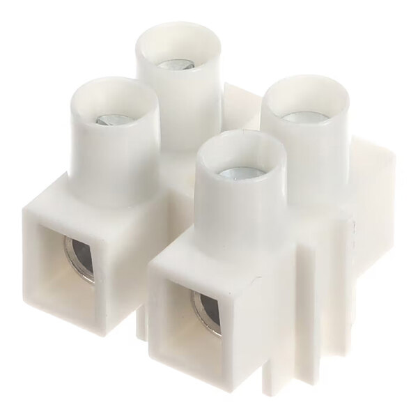 A white plastic terminal block with four cylindrical openings and metal inserts visible inside.