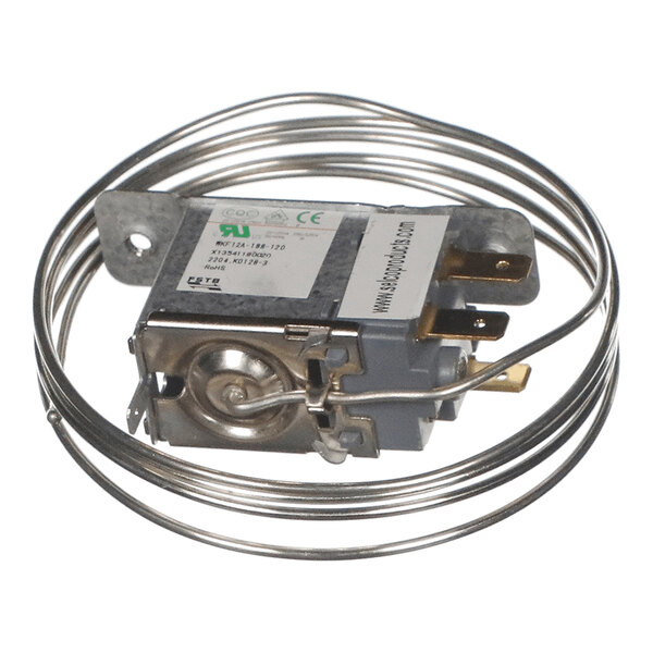 A metallic control device with an attached coiled sensor tube and electrical terminals.