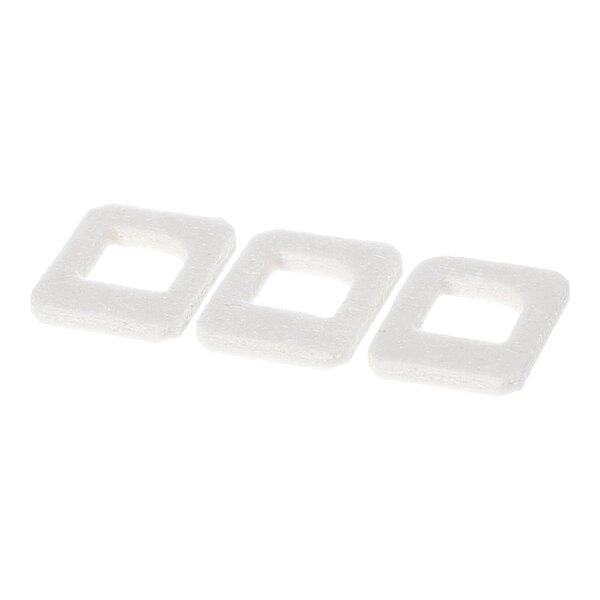 Three white, square-shaped gaskets with rounded edges are arranged in a row on a white background.