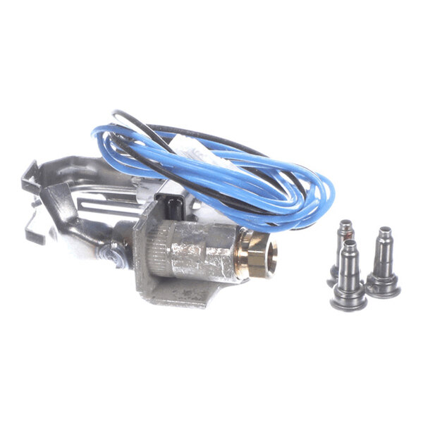 A metallic component with attached blue wires and three small cylindrical metal parts placed beside it, likely part of an assembly kit.