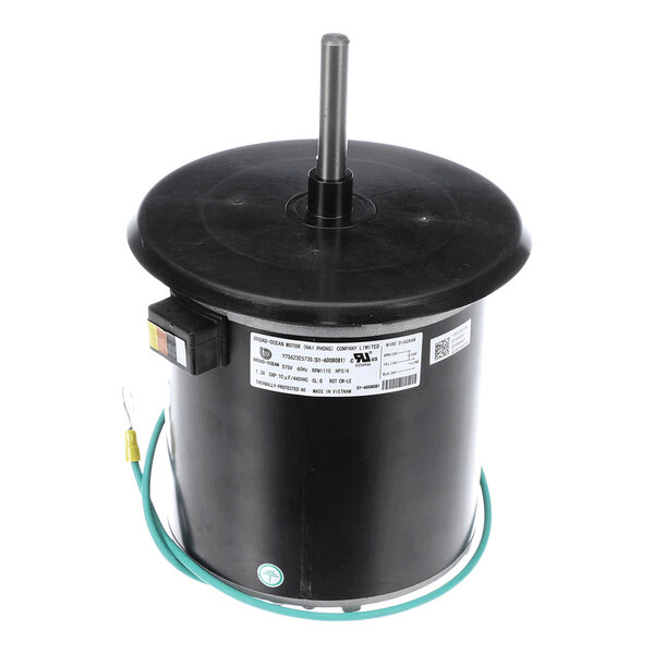A cylindrical black electric motor with a central shaft, a label with specifications, and a green grounding wire attached.