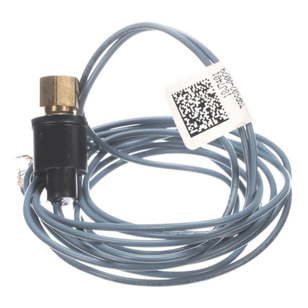 A coiled gray wire with a brass connector and a black plastic component, featuring a white label with a QR code attached.