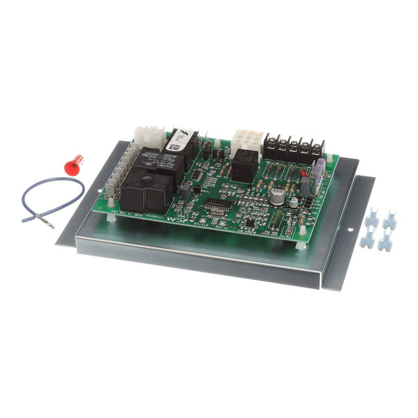 A green electronic circuit board with various components mounted on a metal plate, accompanied by a blue wire, a red connector, and several small blue clips.