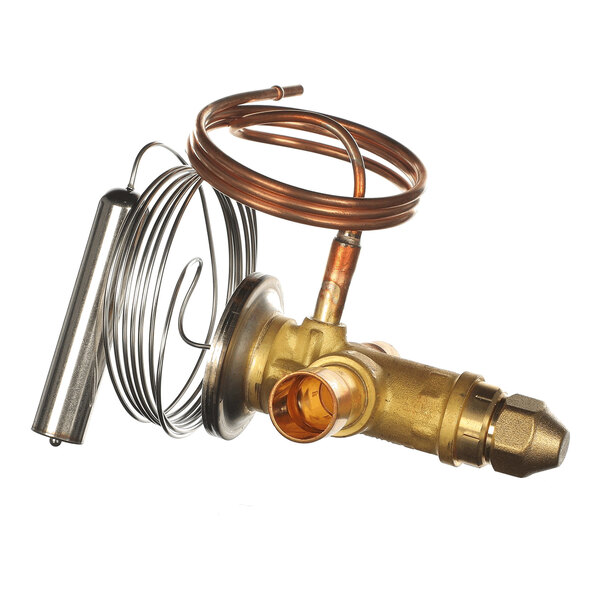 A brass valve assembly with attached copper tubing and a metal cylindrical component, likely part of a refrigeration or HVAC system.