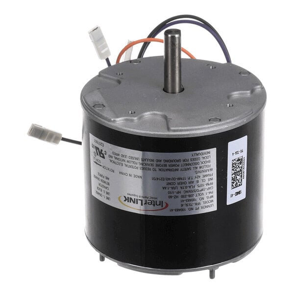 A cylindrical electric motor with a central shaft, attached wires, and a label on the side.