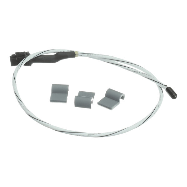A coiled white cable with a black connector on one end, a small black sensor on the other, and four gray plastic clips placed nearby.