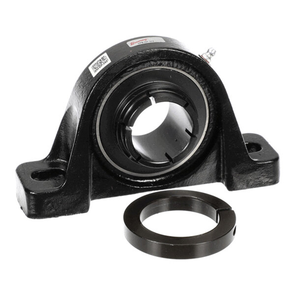 A black metal pillow block bearing housing with a cylindrical bearing insert and a separate locking collar placed in front of it.