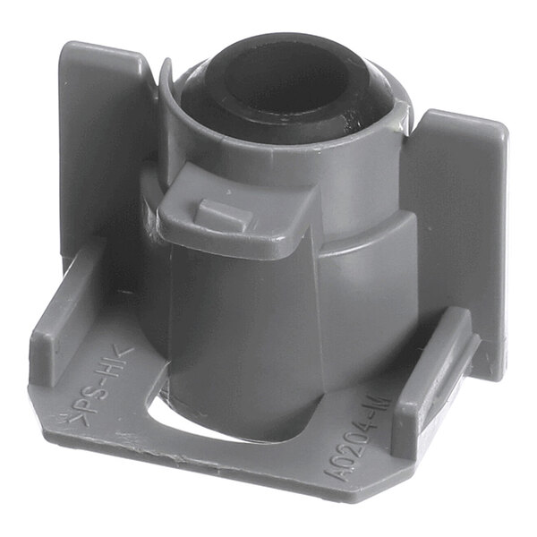 A gray plastic component with a cylindrical center and flat base, featuring raised side panels and molded details.