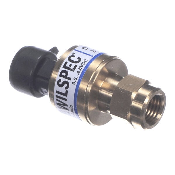 A small cylindrical metal and plastic device with a threaded fitting on one end and an electrical connector on the other, labeled with 'WILSPEC' and voltage information.