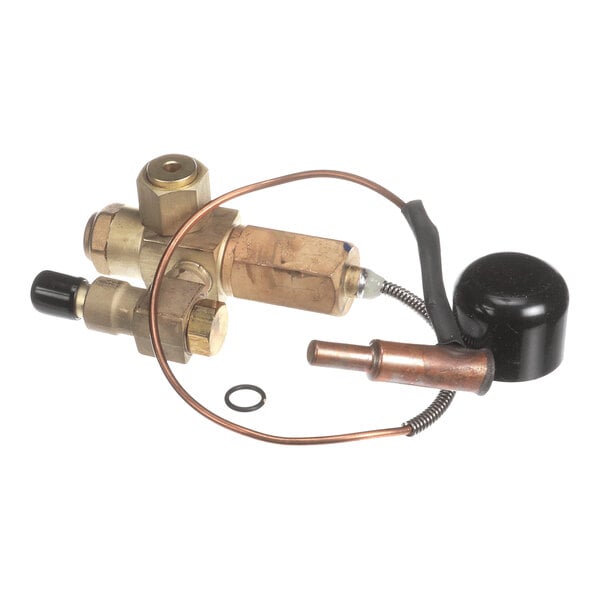 A brass and copper mechanical component with attached tubing and a black cylindrical part, likely part of a temperature control or refrigeration system.