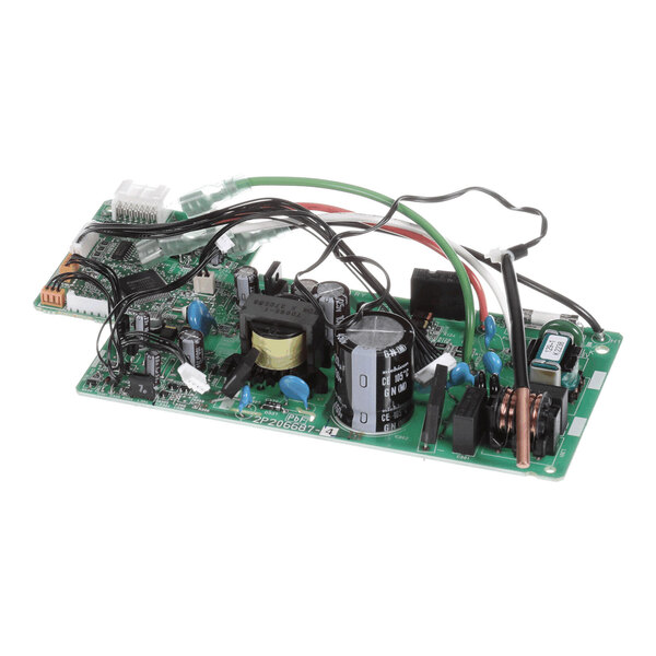 A green printed circuit board with various electronic components, including capacitors, coils, connectors, and wires.